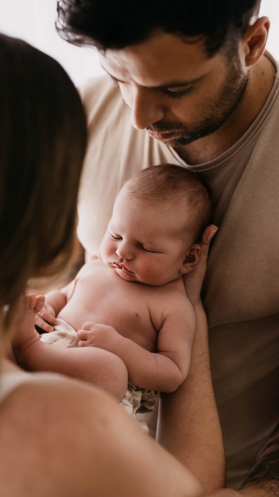 Couple holding baby